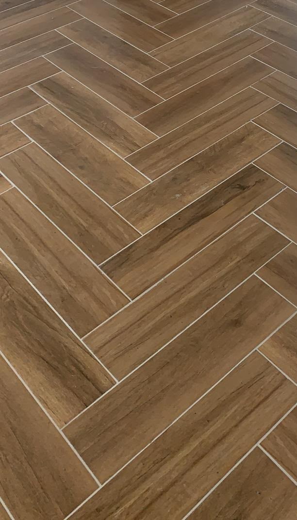 Wooden flooring in London: dark wood-effect herringbone floor