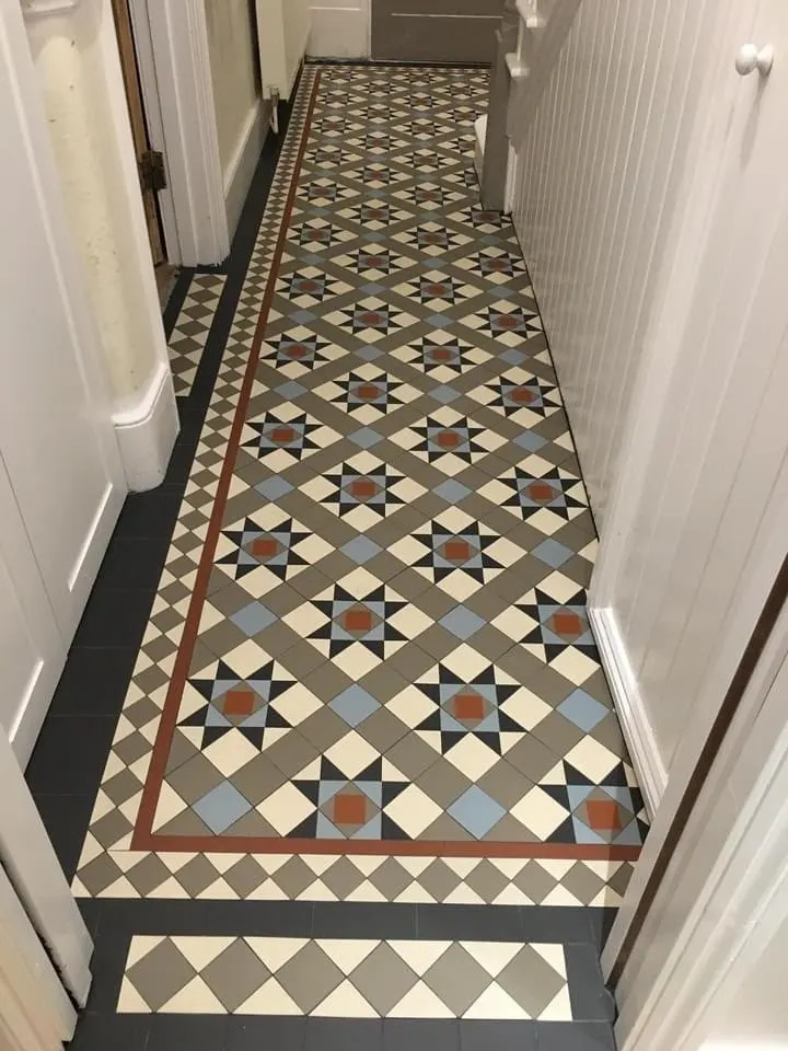 Floor and wall tiling in London: decorative geometric tiled hallway floor