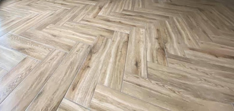 Wooden flooring in London: oak-effect herringbone floor with a glossy finish