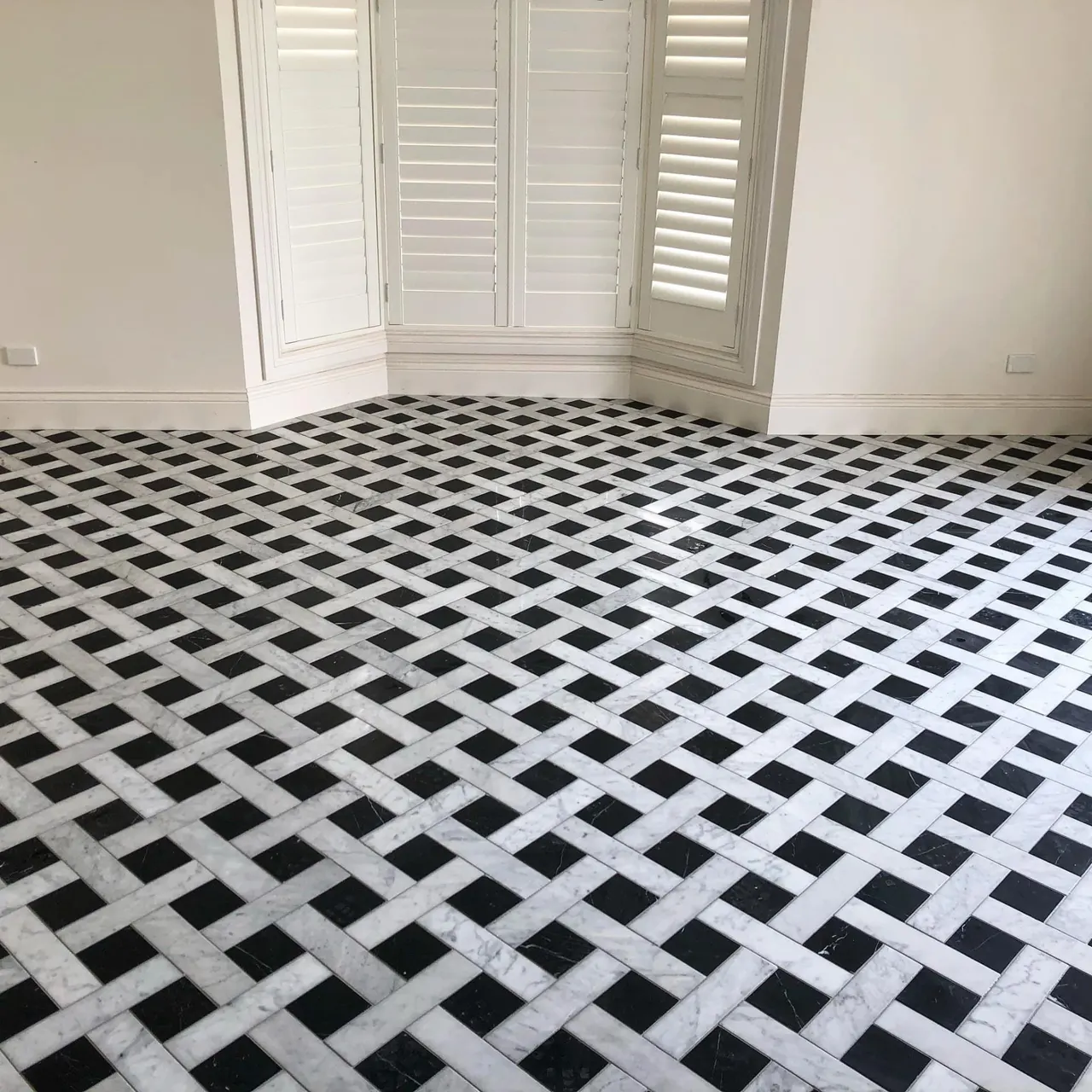 Marble and stone installation in London: black and white marble basketweave floor